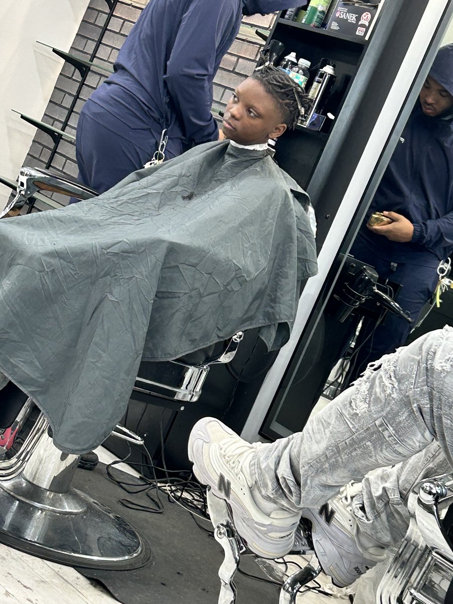 Maya at the barber getting a fresh cut